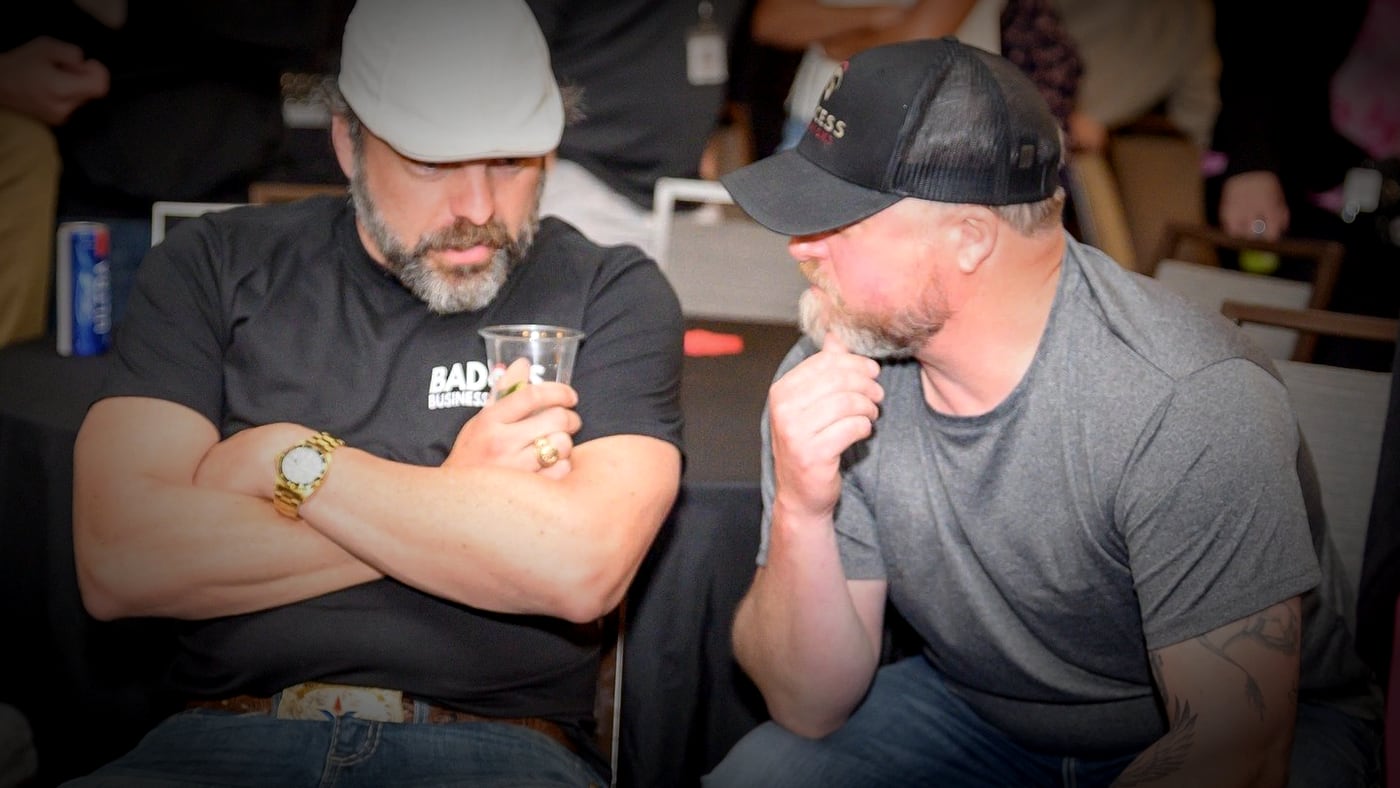 Donnie Boivin listening to attendee Mike Nash during the happy hour at the 2025 Badass Business Summit